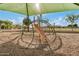 playground with slides and climbing structures under a green sunshade at 4453 S Huachuca Way, Chandler, AZ 85249