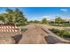 Scenic walking path with desert landscaping and lush green trees, perfect for outdoor activity at 4453 S Huachuca Way, Chandler, AZ 85249