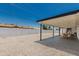 Gravel backyard with covered patio creates a comfortable outdoor retreat for relaxation and entertaining guests at 4613 N 53Rd Dr, Phoenix, AZ 85031
