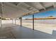 The backyard features a gravel ground, a covered patio, and perimeter wall for added privacy at 4613 N 53Rd Dr, Phoenix, AZ 85031