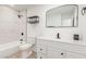 Beautiful bathroom with white vanity, updated fixtures, decorative mirror, and tiled shower at 4613 N 53Rd Dr, Phoenix, AZ 85031