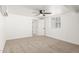 Neutral bedroom with carpet, ceiling fan and a view from the window at 4613 N 53Rd Dr, Phoenix, AZ 85031