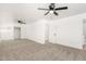 Spacious bedroom with neutral tones, carpet, ceiling fan and ample closet space at 4613 N 53Rd Dr, Phoenix, AZ 85031