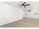 Bright bedroom featuring carpet, ceiling fan, and large open space at 4613 N 53Rd Dr, Phoenix, AZ 85031