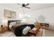 Bright bedroom featuring contemporary furniture, ceiling fan, and natural light at 4613 N 53Rd Dr, Phoenix, AZ 85031