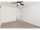 Neutral bedroom with carpet, a ceiling fan, a doorway and closet that provides storage at 4613 N 53Rd Dr, Phoenix, AZ 85031