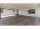 Attached carport showcasing a concrete floor and white brick walls, providing sheltered parking and storage at 4613 N 53Rd Dr, Phoenix, AZ 85031