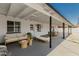 Inviting covered patio features stylish outdoor seating and a dining table for entertaining, offering seamless indoor-outdoor living at 4613 N 53Rd Dr, Phoenix, AZ 85031