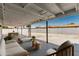 Relaxing covered patio with stylish outdoor seating, perfect for entertaining, with views of the backyard at 4613 N 53Rd Dr, Phoenix, AZ 85031
