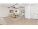 The dining area offers open access to a bright modern kitchen with stainless steel appliances and fixtures at 4613 N 53Rd Dr, Phoenix, AZ 85031