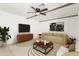 Stylish living room with modern furnishings, a rug, wood accents, and plenty of natural light at 4613 N 53Rd Dr, Phoenix, AZ 85031