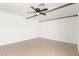 Bright living room with wood-look tile, ceiling fan, and wood beams at 4613 N 53Rd Dr, Phoenix, AZ 85031