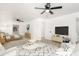 Bright, open living room featuring modern décor and ceiling fan for comfortable living at 4613 N 53Rd Dr, Phoenix, AZ 85031
