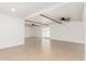 Expansive living area features tile flooring, beamed ceilings, and sliding glass doors to the backyard at 4613 N 53Rd Dr, Phoenix, AZ 85031