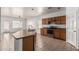 Kitchen with island, stainless steel appliances, oak cabinets, and an open layout, perfect for cooking and entertaining at 513 S 115Th Dr, Avondale, AZ 85323