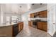 Kitchen with island, stainless steel appliances, oak cabinets, and an open layout, perfect for cooking and entertaining at 513 S 115Th Dr, Avondale, AZ 85323
