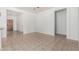 Spacious living room featuring neutral tile flooring, white walls, and an open layout at 513 S 115Th Dr, Avondale, AZ 85323