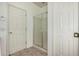 Modern bathroom with a glass-enclosed shower and tile flooring at 513 S 115Th Dr, Avondale, AZ 85323