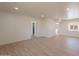 Open basement area with wood-look floors, a view into a bathroom, and recessed lighting at 5132 N 83Rd St, Scottsdale, AZ 85250