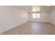 Large basement featuring wood-look floors, wainscoting, and plenty of natural light at 5132 N 83Rd St, Scottsdale, AZ 85250