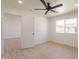 This bedroom features light wood floors, a ceiling fan, and an ensuite at 5132 N 83Rd St, Scottsdale, AZ 85250