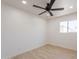 This bright bedroom features light wood floors and a ceiling fan at 5132 N 83Rd St, Scottsdale, AZ 85250