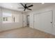 Bright bedroom with wood floors, sliding door closet and a view to outside at 5132 N 83Rd St, Scottsdale, AZ 85250