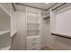 This closet features custom shelving and storage, and black hardware at 5132 N 83Rd St, Scottsdale, AZ 85250