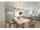 Bright dining room featuring a large table, stylish chairs, and a view of the kitchen at 5132 N 83Rd St, Scottsdale, AZ 85250