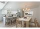 Inviting dining area with a wooden table, woven chairs, and a modern chandelier at 5132 N 83Rd St, Scottsdale, AZ 85250