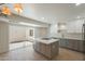 Bright kitchen showcasing a large island, modern appliances, and a sliding glass door to the outdoor space at 5132 N 83Rd St, Scottsdale, AZ 85250