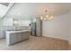 Modern kitchen with gray cabinets, stainless steel appliances, island, and a unique chandelier at 5132 N 83Rd St, Scottsdale, AZ 85250