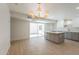 Open-concept kitchen and living area with a sliding glass door to the outside, and a gray island at 5132 N 83Rd St, Scottsdale, AZ 85250