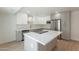 Well-appointed kitchen with gray cabinets, a large white island, stainless appliances, and modern finishes at 5132 N 83Rd St, Scottsdale, AZ 85250