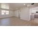 Spacious living room with wood-look floors, natural light, and a view into the kitchen at 5132 N 83Rd St, Scottsdale, AZ 85250