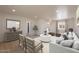Open-concept living room with stylish furniture, a large rug, and plenty of natural light at 5132 N 83Rd St, Scottsdale, AZ 85250