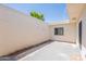 Enclosed patio with concrete floor, with a view of a tree in the background at 5132 N 83Rd St, Scottsdale, AZ 85250