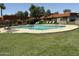 A beautiful community pool with lounge chairs for relaxing in the sun at 5132 N 83Rd St, Scottsdale, AZ 85250