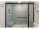 This updated shower features modern tile, a bench seat, and a glass enclosure at 5132 N 83Rd St, Scottsdale, AZ 85250