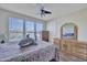 Cozy bedroom with light walls and a large window with blinds at 5144 W Sweetwater Ave, Glendale, AZ 85304