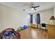 Bright bedroom with hardwood floors, a window, and toys at 5144 W Sweetwater Ave, Glendale, AZ 85304