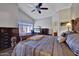 Comfortable bedroom featuring a ceiling fan and neutral walls at 5144 W Sweetwater Ave, Glendale, AZ 85304