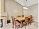 Inviting dining room featuring a table, fireplace, and modern lighting at 5144 W Sweetwater Ave, Glendale, AZ 85304