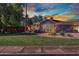 Charming single-story home featuring a well-manicured lawn at 5144 W Sweetwater Ave, Glendale, AZ 85304