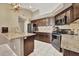 Kitchen boasts stainless steel appliances and granite countertops at 5144 W Sweetwater Ave, Glendale, AZ 85304
