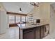 Kitchen with granite countertop, kitchen island, and breakfast nook at 5144 W Sweetwater Ave, Glendale, AZ 85304