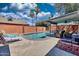 A refreshing swimming pool surrounded by lounge chairs and mature trees at 5144 W Sweetwater Ave, Glendale, AZ 85304