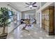 Bright sunroom featuring a vaulted ceiling, tile flooring and outdoor access at 5144 W Sweetwater Ave, Glendale, AZ 85304