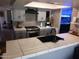 Modern kitchen featuring stainless steel appliances, light cabinets, and sleek countertops at 5539 N 31St Ln, Phoenix, AZ 85017