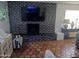 Inviting living room with brick fireplace and flat screen TV, perfect for relaxation at 5539 N 31St Ln, Phoenix, AZ 85017